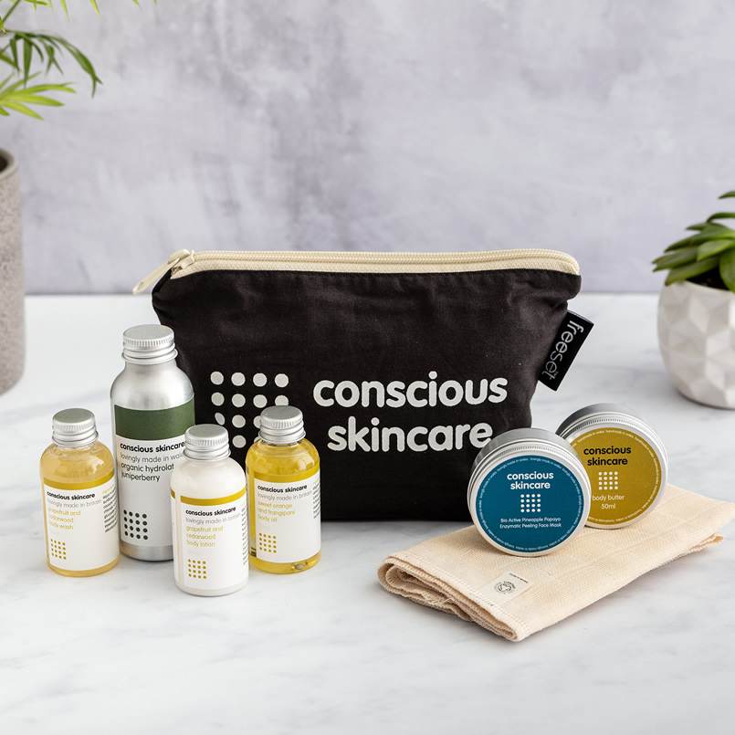 A range of Conscious Skincare products and a branded wash bag